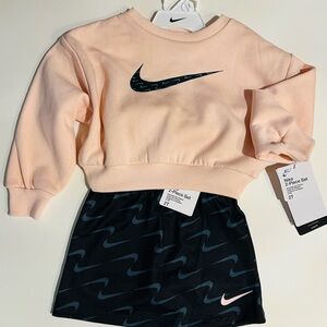 Nike Kids Peach Sweatshirt and Black Skort Set with coordinated Swoosh